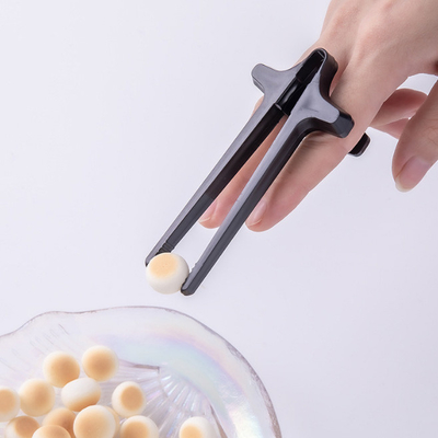 Palillos de dedo de cocina para jugadores con ayudante